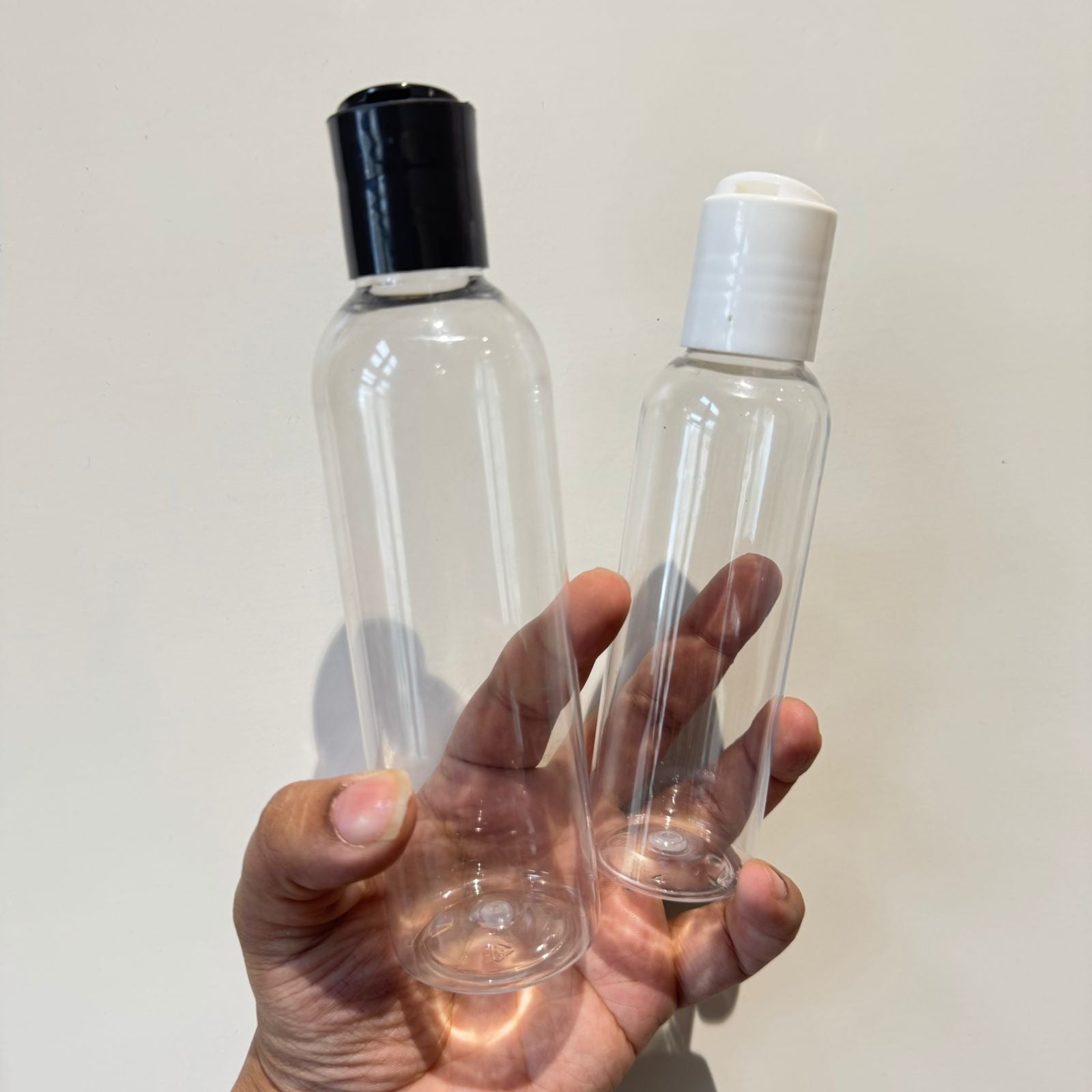 Cosmetic Boston Round Pet Bottle + Disc Cap - White, Black (100ml/ 200ml)