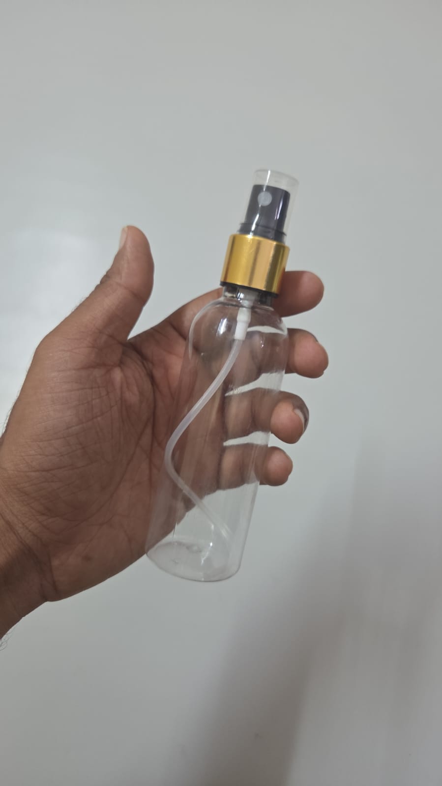 Cosmetic Round Pet Bottle with Spray Pump - Gold Sleeve Neck (50ml, 100ml)